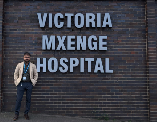 Image of Dr Moin Uddin Mujeeb standing outside of hospital