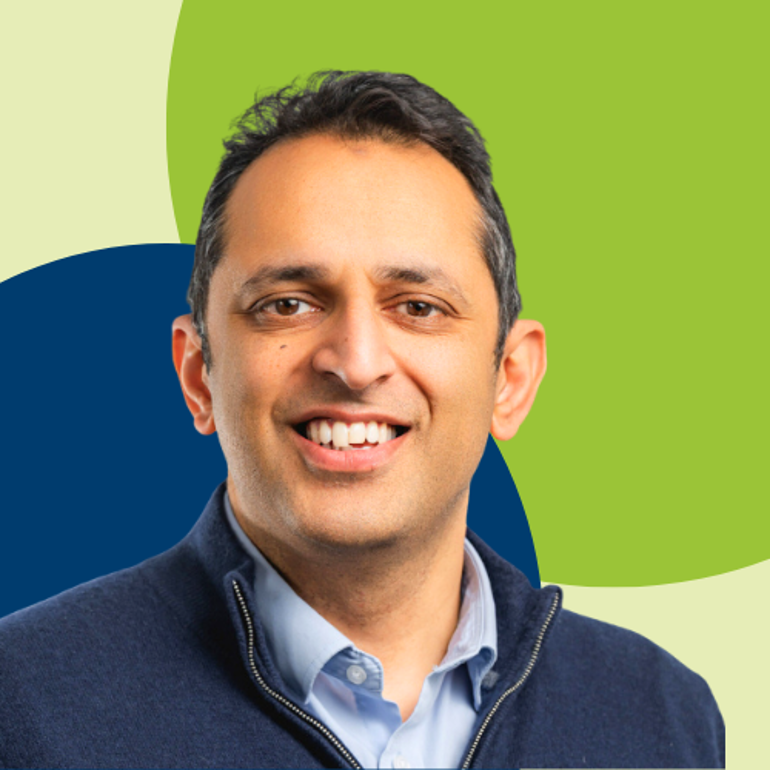 Professor Kev Dhaliwal smiling at the camera